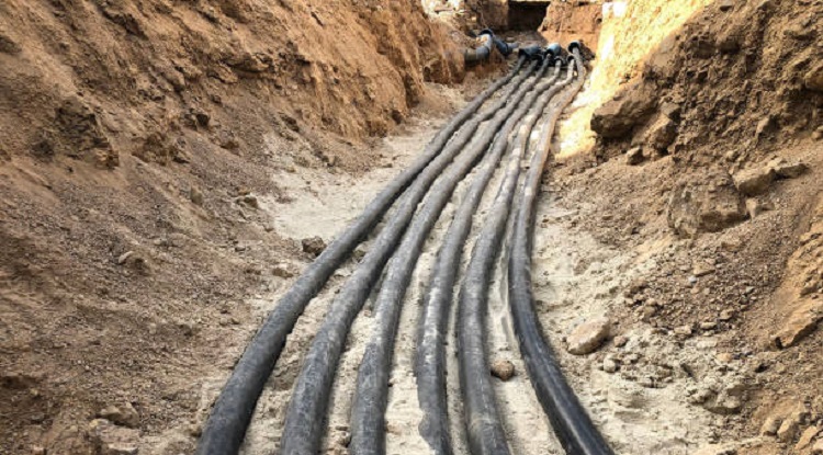 The high voltage electrical cable is laid in a trench.